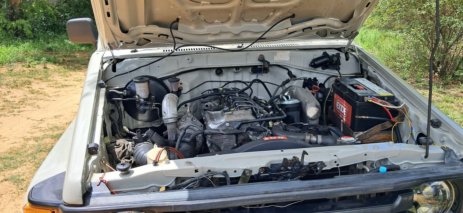 Engine bay during custom 4x4 build — Willys CJ-2A restoration workshop