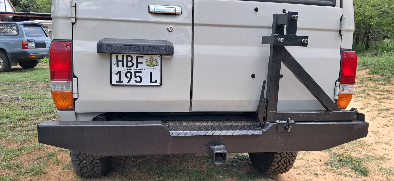 Custom rear bumper and carrier rack — fabricated in workshop
