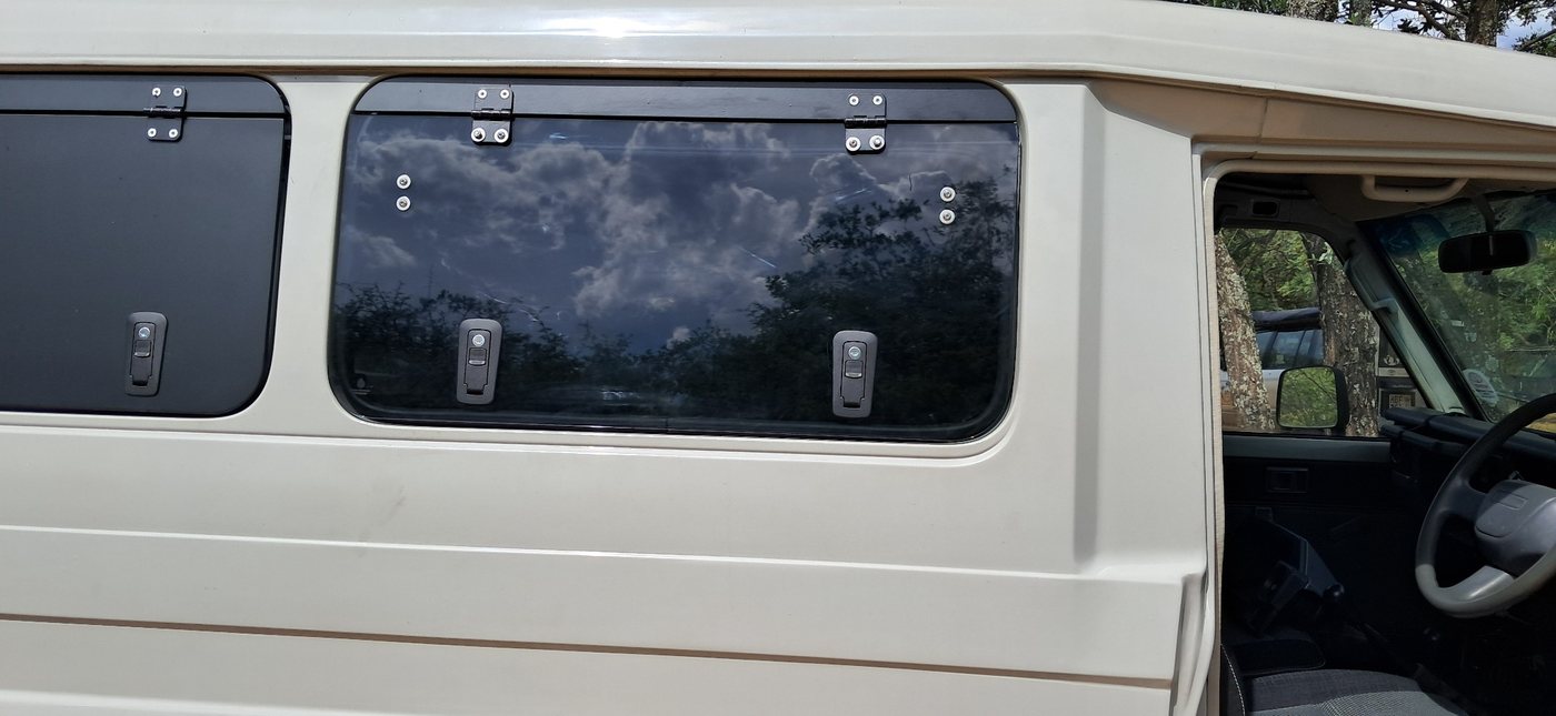 Glass gullwing — tinted closed panel on Toyota Troopy