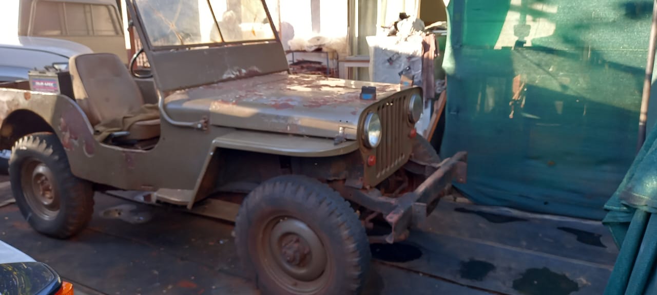Willys Jeep being towed home on trailer