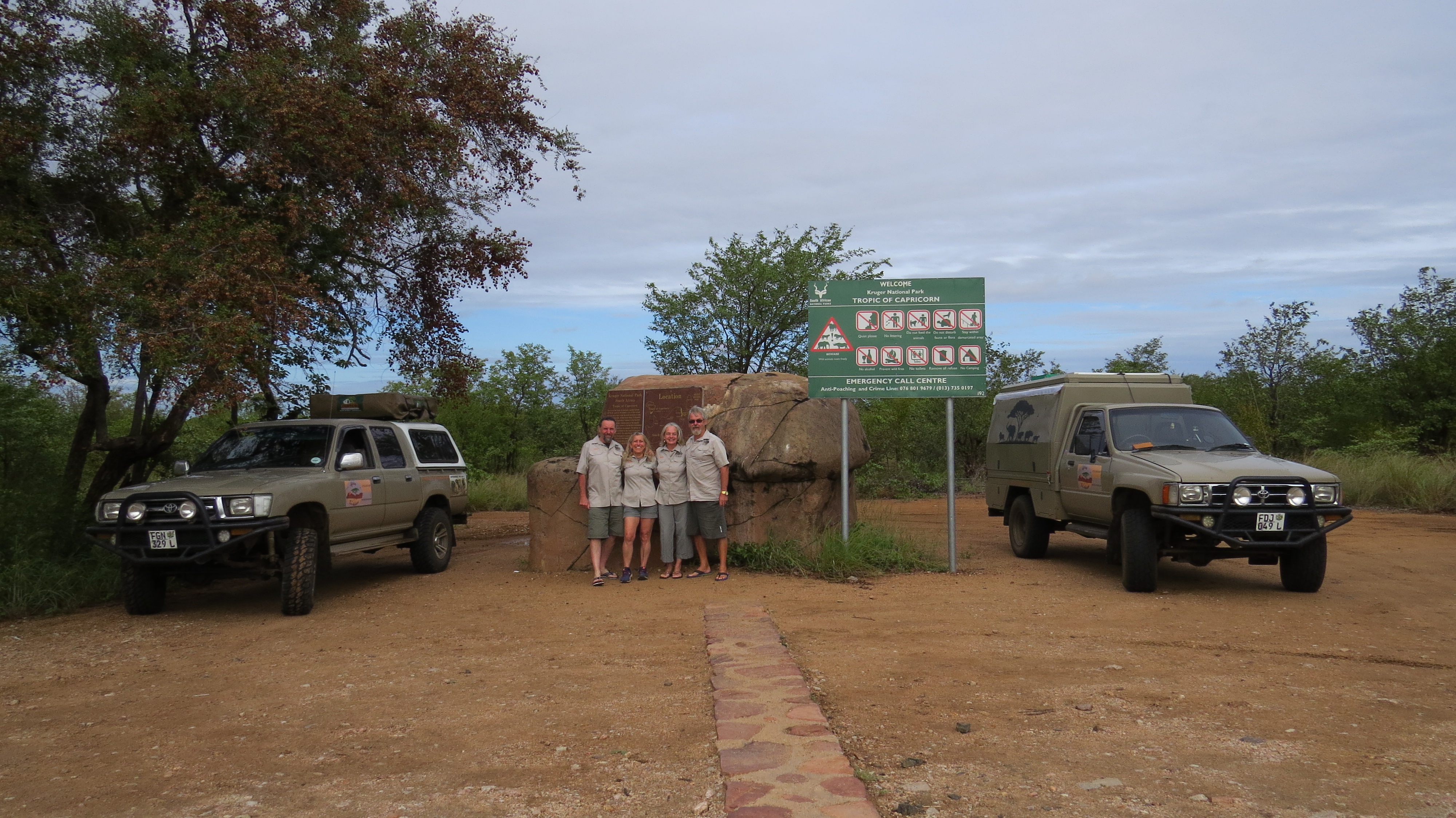 Group with two 4x4 vehicles at the Kruger National Park Tropic of Capricorn sign